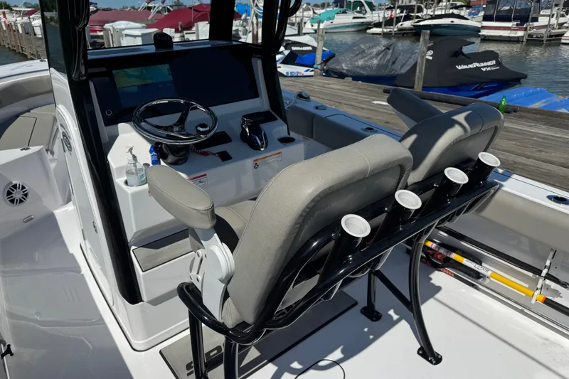 Slide: The Image of 2024 Sportsman Heritage 231 Center Console boat interior with helm and seating. - 8