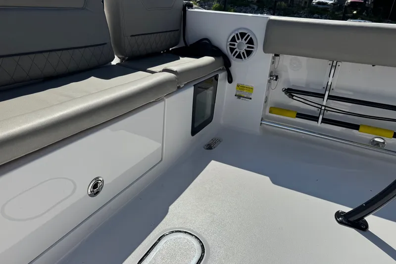 Slide: The Image of 2024 Sportsman Heritage 231 Center Console interior with seating and storage features. - 26