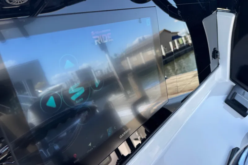 Slide: The Image of 2024 Sportsman Heritage 231 Center Console with Garmin display at marina. - 13
