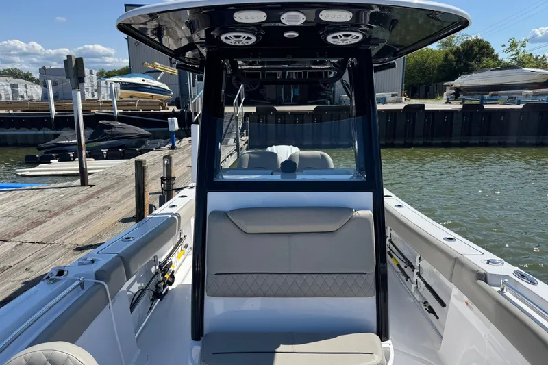 Slide: The Image of 2024 Sportsman Heritage 231 Center Console boat docked at marina. - 21