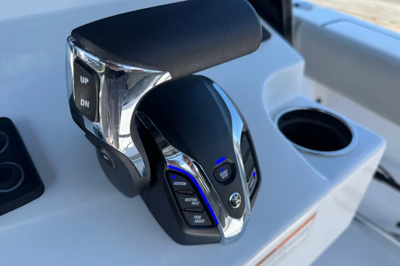 Slide: The Image of Throttle control on 2024 Sportsman Heritage 231 Center Console boat dashboard. - 11