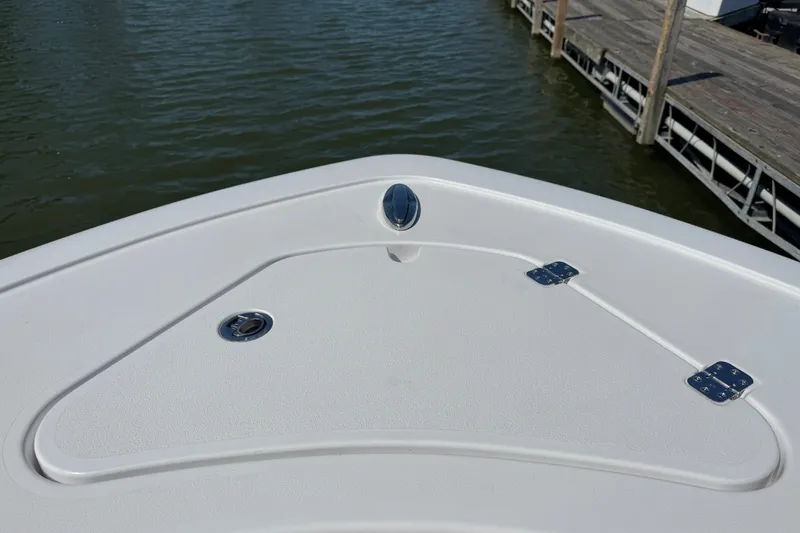 Slide: The Image of 2024 Sportsman Heritage 231 Center Console boat deck near dock. - 18