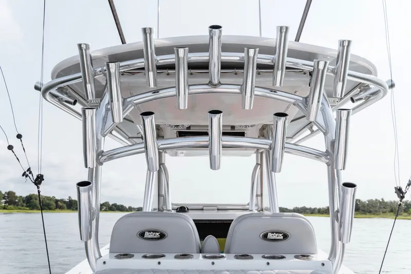 Slide: The Image of 2018 Onslow Bay 33 Tournament Edition boat with multiple rod holders on the T-top. - 17