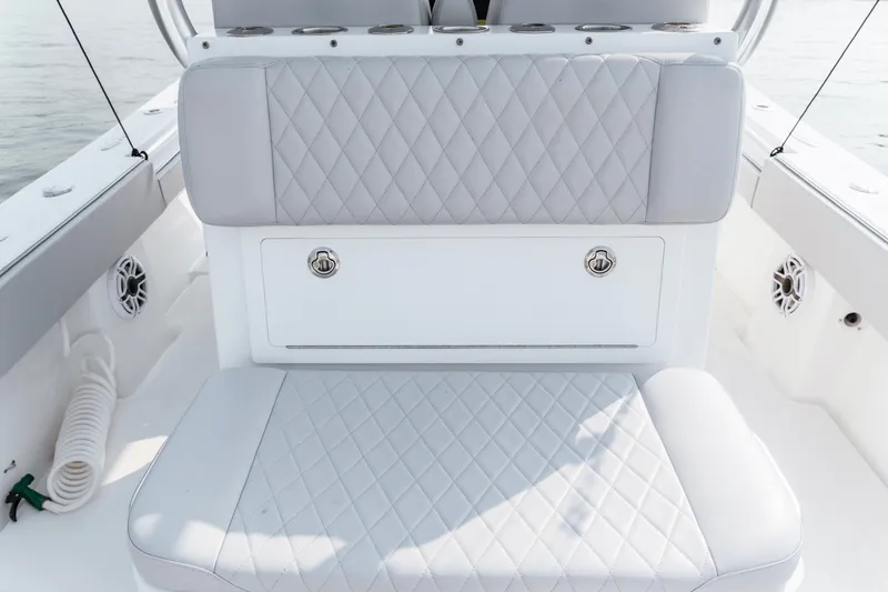 Slide: The Image of 2018 Onslow Bay 33 Tournament Edition boat seating with diamond-stitched upholstery. - 19