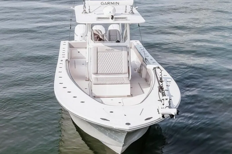 Slide: The Image of 2018 Onslow Bay 33 Tournament Edition boat on water, featuring Garmin equipment. - 12