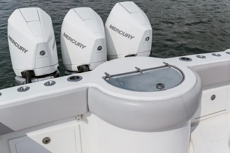 Slide: The Image of 2018 Onslow Bay 33 Tournament Edition boat with triple Mercury engines and livewell. - 18