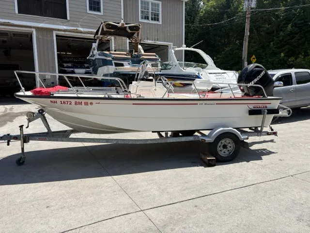 Slide: The Image of A 2007 Boston Whaler 170 Montauk on a trailer in front of a workshop. - 4