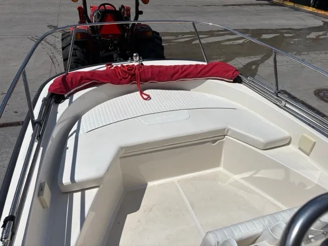 Slide: The Image of The image shows the bow of a 2007 Boston Whaler 170 Montauk with red cushions. - 5