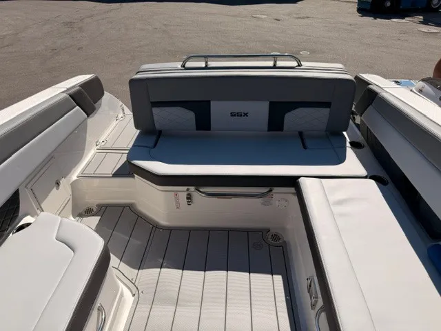 Slide: The Image of The image shows the stern of a 2026 Chaparral SSX 8 with cushioned seating and an SSX logo. - 8