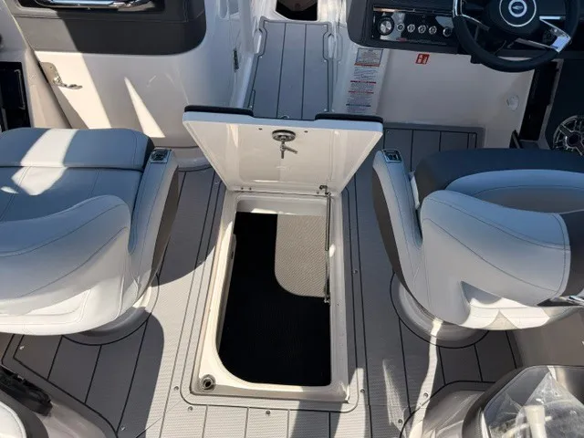 Slide: The Image of The image shows the interior of a 2026 Chaparral SSX 8 with an open floor storage compartment. - 6