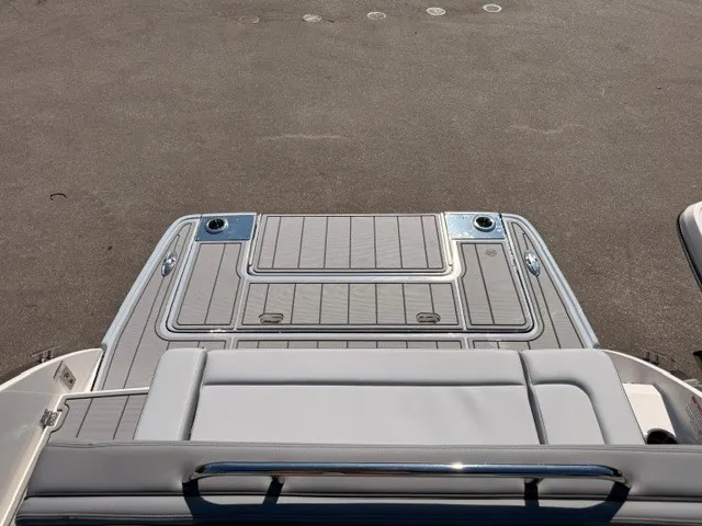 Slide: The Image of The image shows the stern of a Chaparral SSX 8 boat with a spacious swim platform. - 9