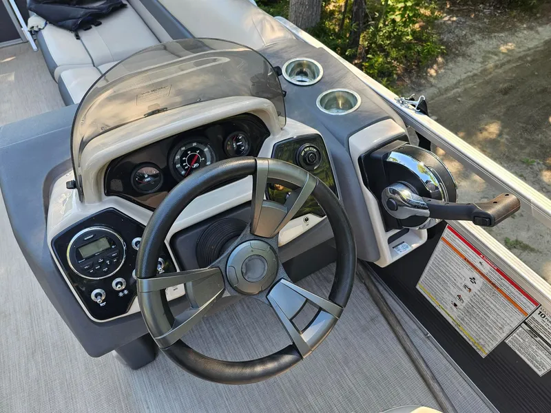 Slide: The Image of The image shows the helm of a 2019 Princecraft Vectra 21 with steering wheel and instruments. - 6