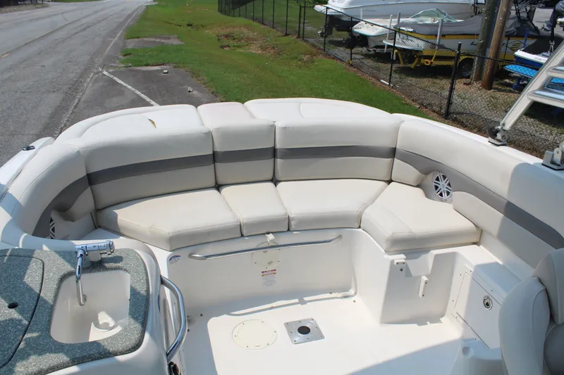 Slide: The Image of The image shows the stern of a 2007 Chaparral 246 SSi boat with cushioned seating. - 12