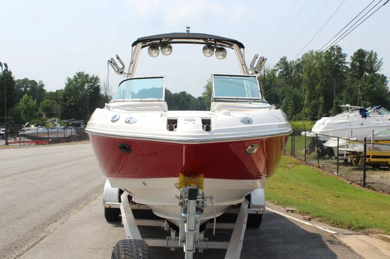 Slide: The Image of A red 2007 Chaparral 246 SSi boat is on a trailer on a road. - 4