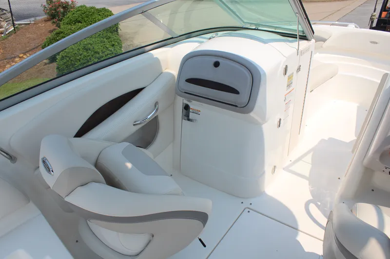 Slide: The Image of The image shows the cockpit of a 2007 Chaparral 246 SSi with beige seating and a helm station. - 11