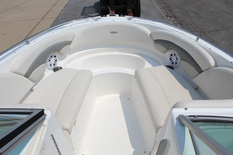 Slide: The Image of The image shows the bow area of a Chaparral 246 SSi boat with white cushioned seating. - 13