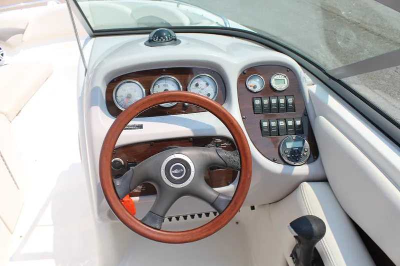 Slide: The Image of The image shows the cockpit of a 2007 Chaparral 246 SSi with a wooden steering wheel and instruments. - 9