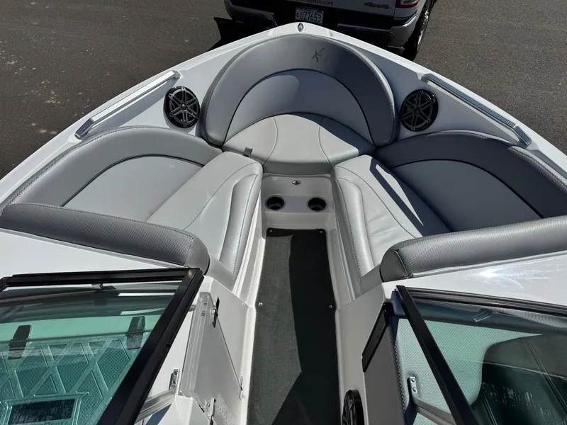 Slide: The Image of The image shows the bow of a 2016 MasterCraft X10 with gray upholstery and speakers. - 15