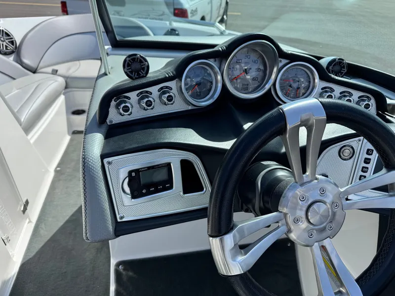 Slide: The Image of The image shows the dashboard of a 2016 MasterCraft X10 with multiple gauges and a steering wheel. - 26