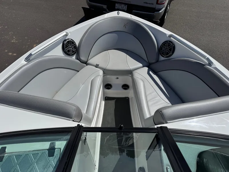 Slide: The Image of The image shows the bow of a 2016 MasterCraft X10 with gray upholstery and speakers. - 14