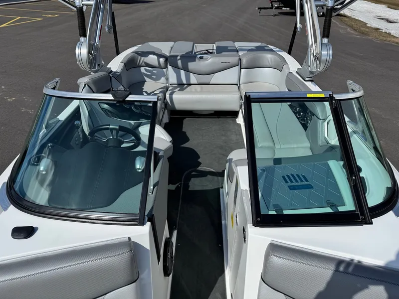 Slide: The Image of The image shows the cockpit of a 2016 MasterCraft X10 with gray seating and an open deck. - 18