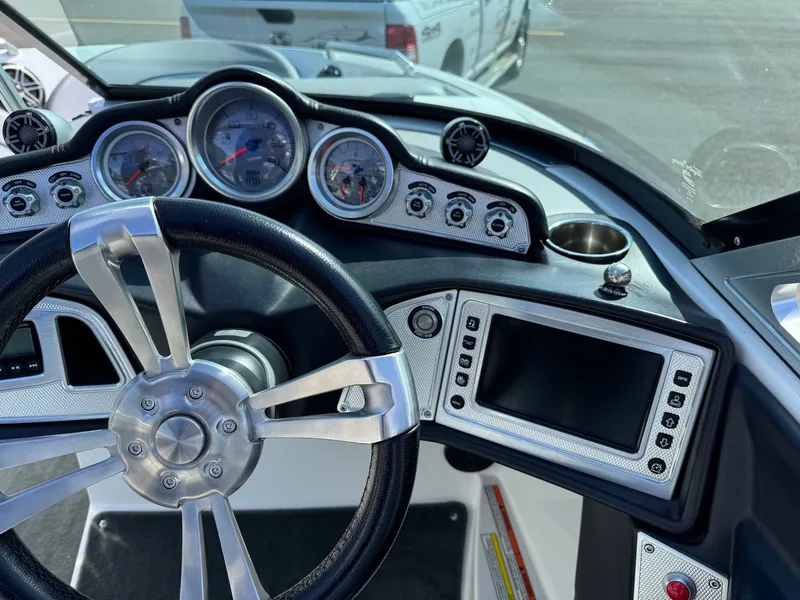 Slide: The Image of The image shows the dashboard of a 2016 MasterCraft X10 with modern gauges and a screen. - 25