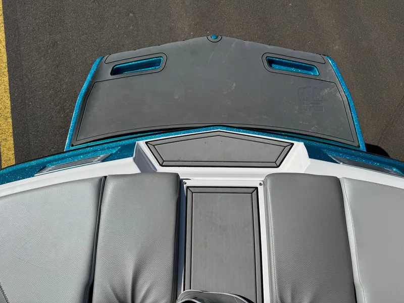 Slide: The Image of The image shows the stern of a 2016 MasterCraft X10 with gray and blue accents. - 28