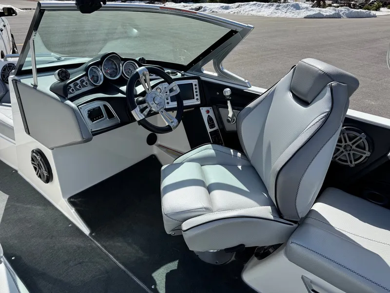 Slide: The Image of The image shows the cockpit of a 2016 MasterCraft X10 with a modern helm station. - 23