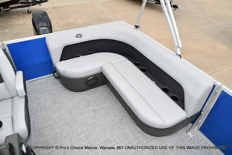 Slide: The Image of The image shows a gray and black seating area on a boat with blue side panels. - 3