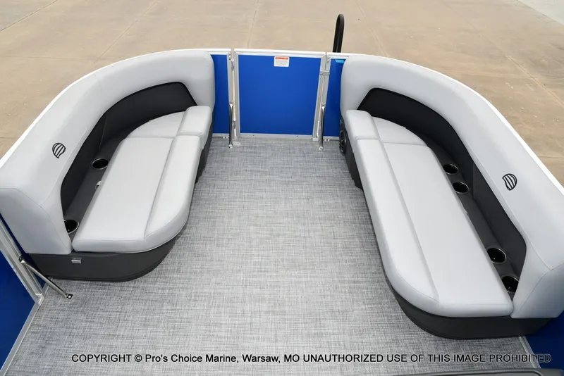 Slide: The Image of The image shows the interior of a 2027 Sun Tracker Party Barge 16 with gray seating. - 9