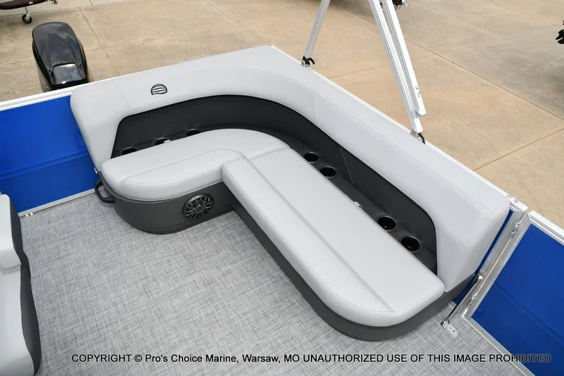 Slide: The Image of The image shows a gray seating area on a Sun Tracker Party Barge 16 boat. - 10