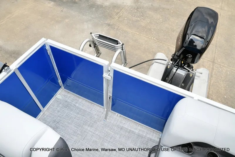 Slide: The Image of The image shows the rear of a Sun Tracker Party Barge 16 pontoon boat with an outboard motor. - 6