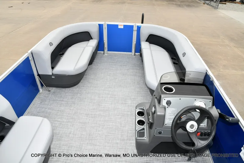 Slide: The Image of The image shows the interior of a 2027 Sun Tracker Party Barge 16 with gray seating. - 8