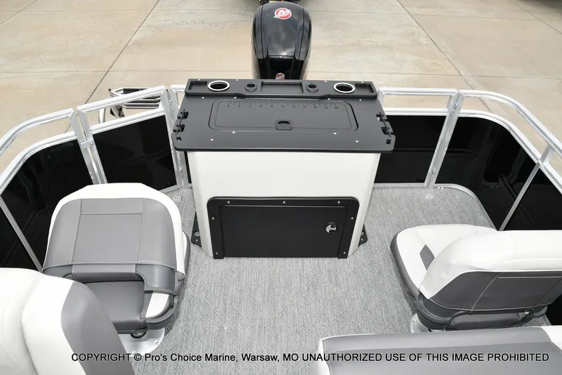 Slide: The Image of The image shows the cockpit of a 2027 Sun Tracker Fishin' Barge 20 DLX with gray seating. - 8