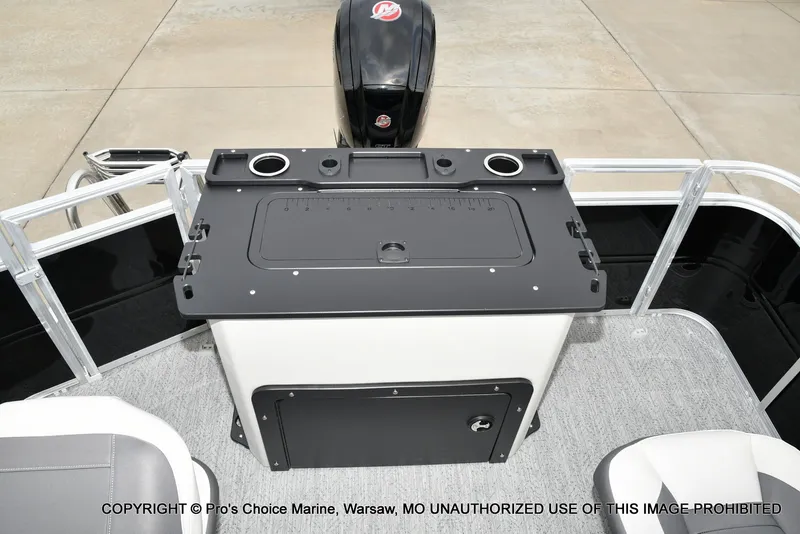 Slide: The Image of The image shows the helm of a 2027 Sun Tracker Fishin' Barge 20 DLX. - 11