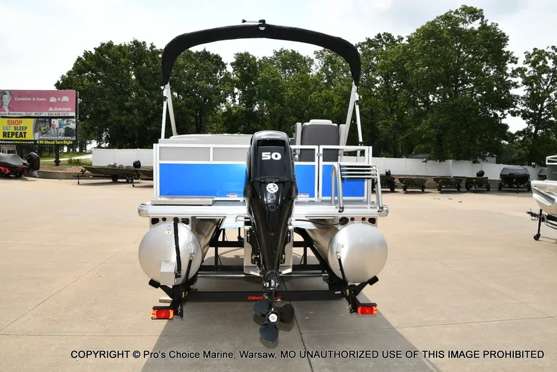 Slide: The Image of A 2027 Sun Tracker Bass Buggy 16 XL Select on a trailer, featuring a 50 HP motor. - 19