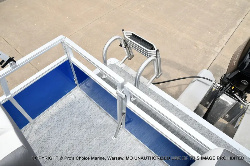 Slide: The Image of The image shows the rear of a Sun Tracker Bass Buggy 16 XL Select with a ladder. - 8
