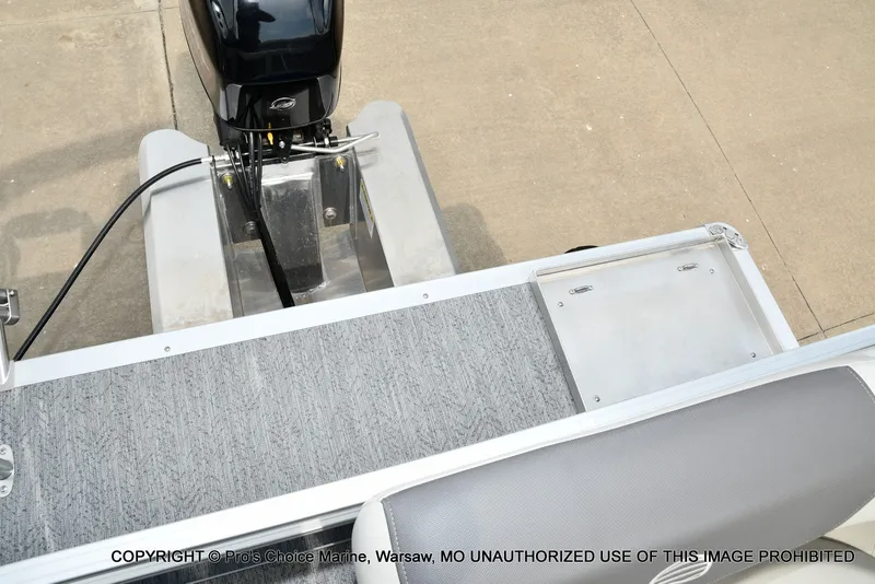 Slide: The Image of The image shows the rear of a Sun Tracker Bass Buggy 16 XL Select with an outboard motor. - 9