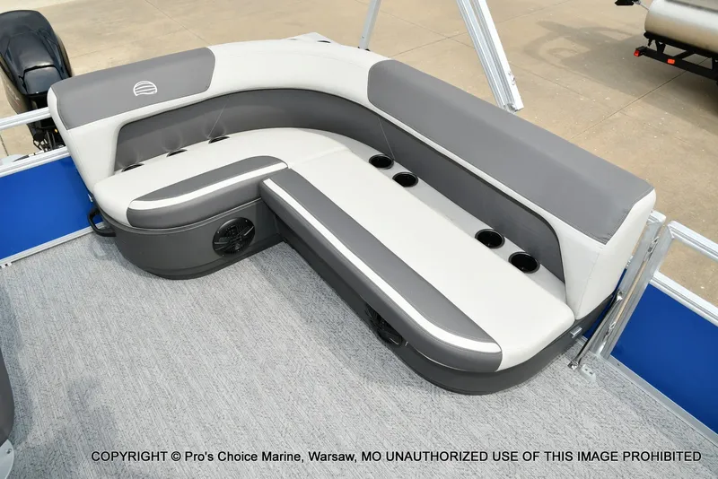 Slide: The Image of Gray and white seating on a boat with blue accents and carpeted floor. - 7