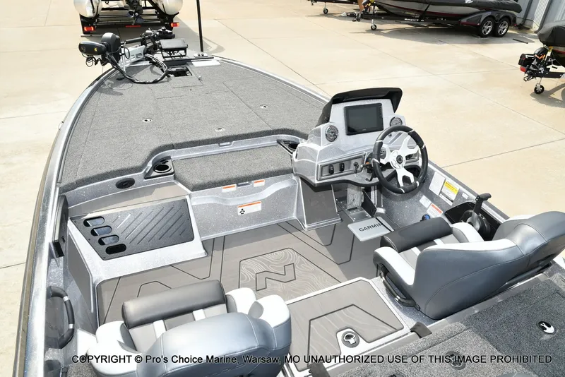 Slide: The Image of The image shows the cockpit of a Nitro Z19 XL Pro boat with gray seats and a helm station. - 43