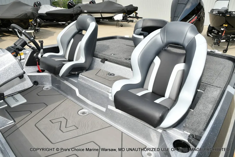 Slide: The Image of The image shows the cockpit of a Nitro Z19 XL Pro boat with two padded seats. - 16