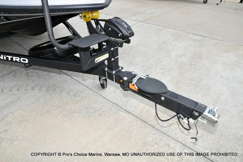 Slide: The Image of Close-up of a 2027 Nitro Z19 XL Pro boat trailer on a concrete floor. - 35