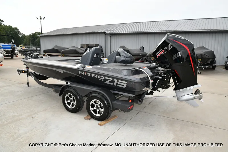 Slide: The Image of A gray Nitro Z19 XL Pro boat from 2027 is on a trailer in an outdoor area. - 29