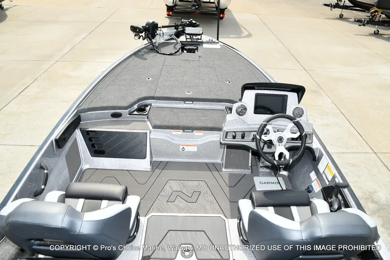 Slide: The Image of The image shows the cockpit of a Nitro Z19 XL Pro boat with modern instruments and gray seats. - 44