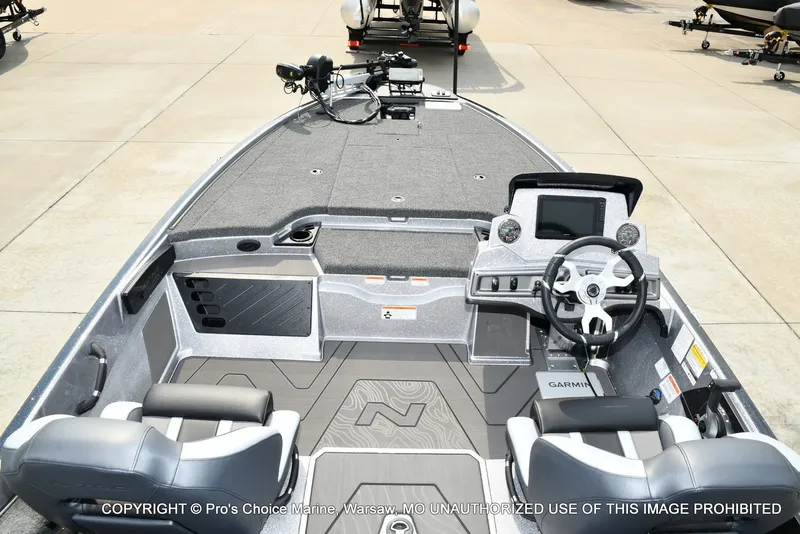 Slide: The Image of The image shows the cockpit of a Nitro Z19 XL Pro boat with modern instruments and gray seating. - 17