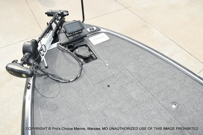 Slide: The Image of The image shows the deck of a Nitro Z19 XL Pro boat with gray carpeting and a fish finder. - 18