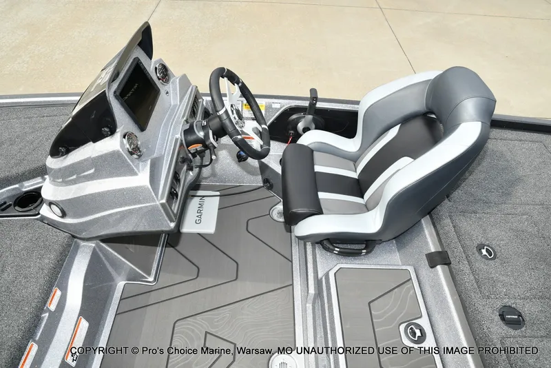 Slide: The Image of The image shows the cockpit of a Nitro Z19 XL Pro boat with a modern helm and cushioned seat. - 47