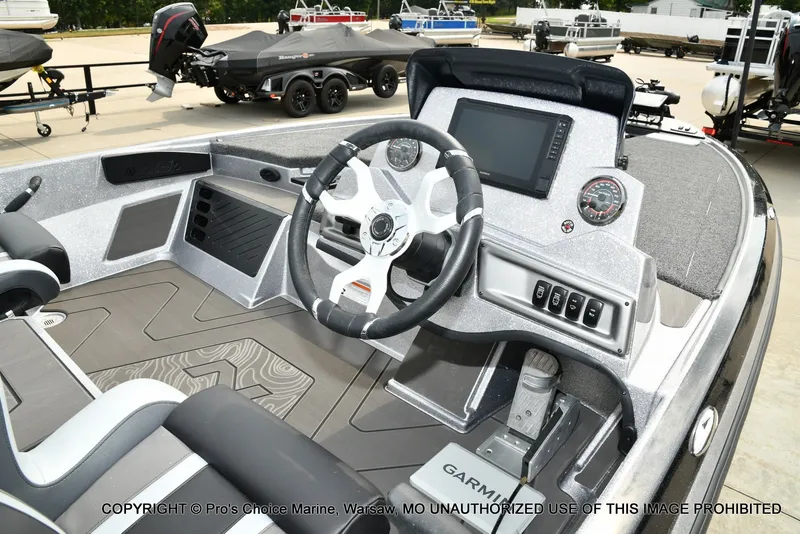 Slide: The Image of The image shows the cockpit of a Nitro Z19 XL Pro boat with a modern helm and instruments. - 40