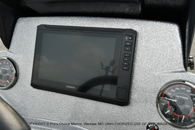 Slide: The Image of The image shows a modern dashboard with a large Garmin display and two round gauges. - 13