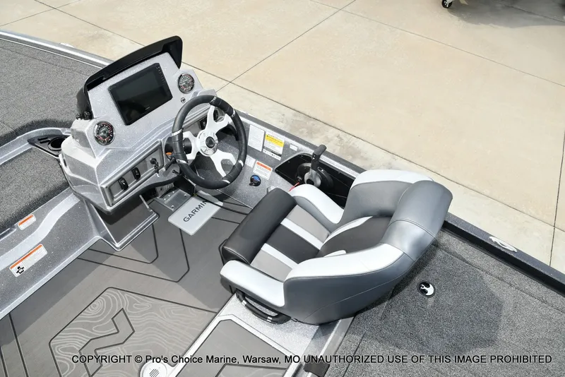 Slide: The Image of The image shows the cockpit of a Nitro Z19 XL Pro boat with a modern helm and comfortable seating. - 45